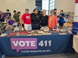 League members and Loud Light staff at a voter information table